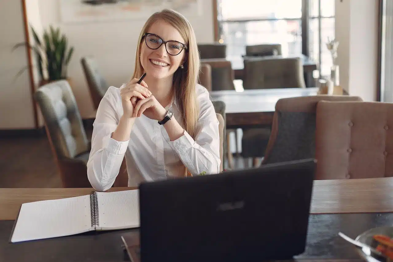 a lady in an online meeting thru her laptop working remotely