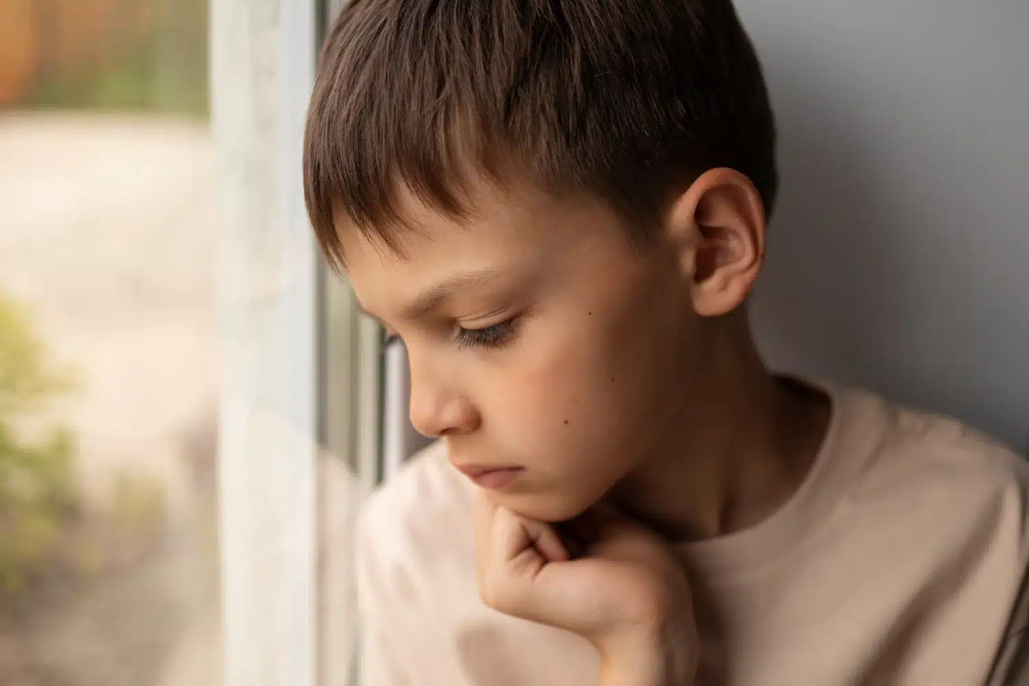a sensitive child looking sad because of lack of confidence